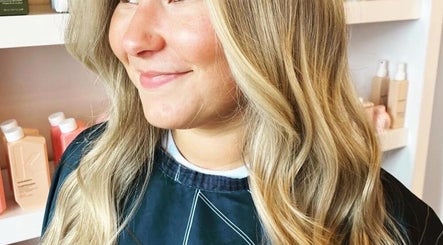 Woman with styled blonde waves at Beauty in Detail, Houston, Texas, US.