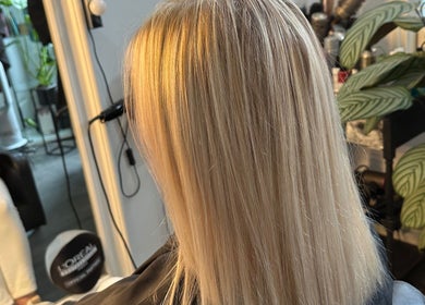 Blonde hair styled at KS Hair Salon in Windsor, England, GB, showcasing sleek, expertly crafted layers.