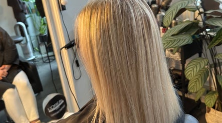 Blonde hair styled at KS Hair Salon in Windsor, England, GB, showcasing sleek, expertly crafted layers.