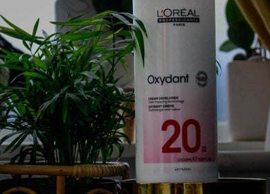 L'Oréal Oxydant on display at KS Hair Salon, Windsor, England, GB, surrounded by lush greenery.