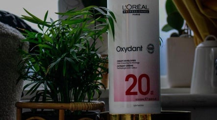L'Oréal Oxydant on display at KS Hair Salon, Windsor, England, GB, surrounded by lush greenery.