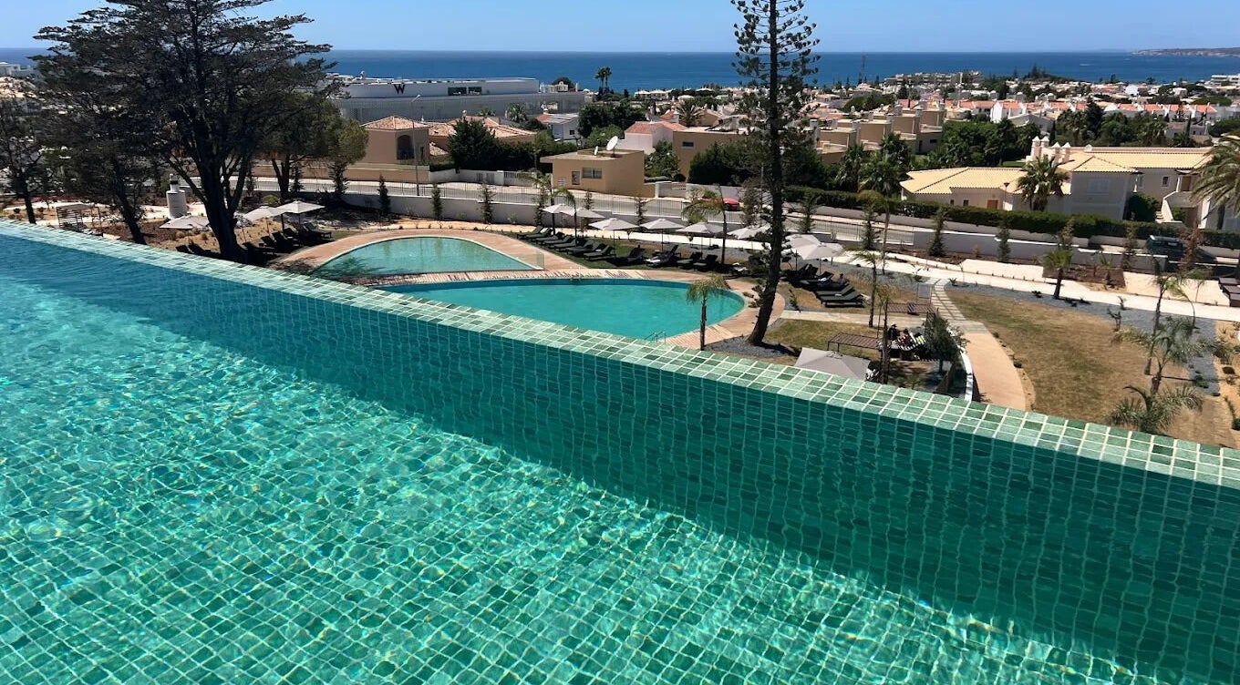 Infinity pool at Slow Living Spa - Ananea Castelo Suites Hotel overlooking Albufeira, PT with ocean view.