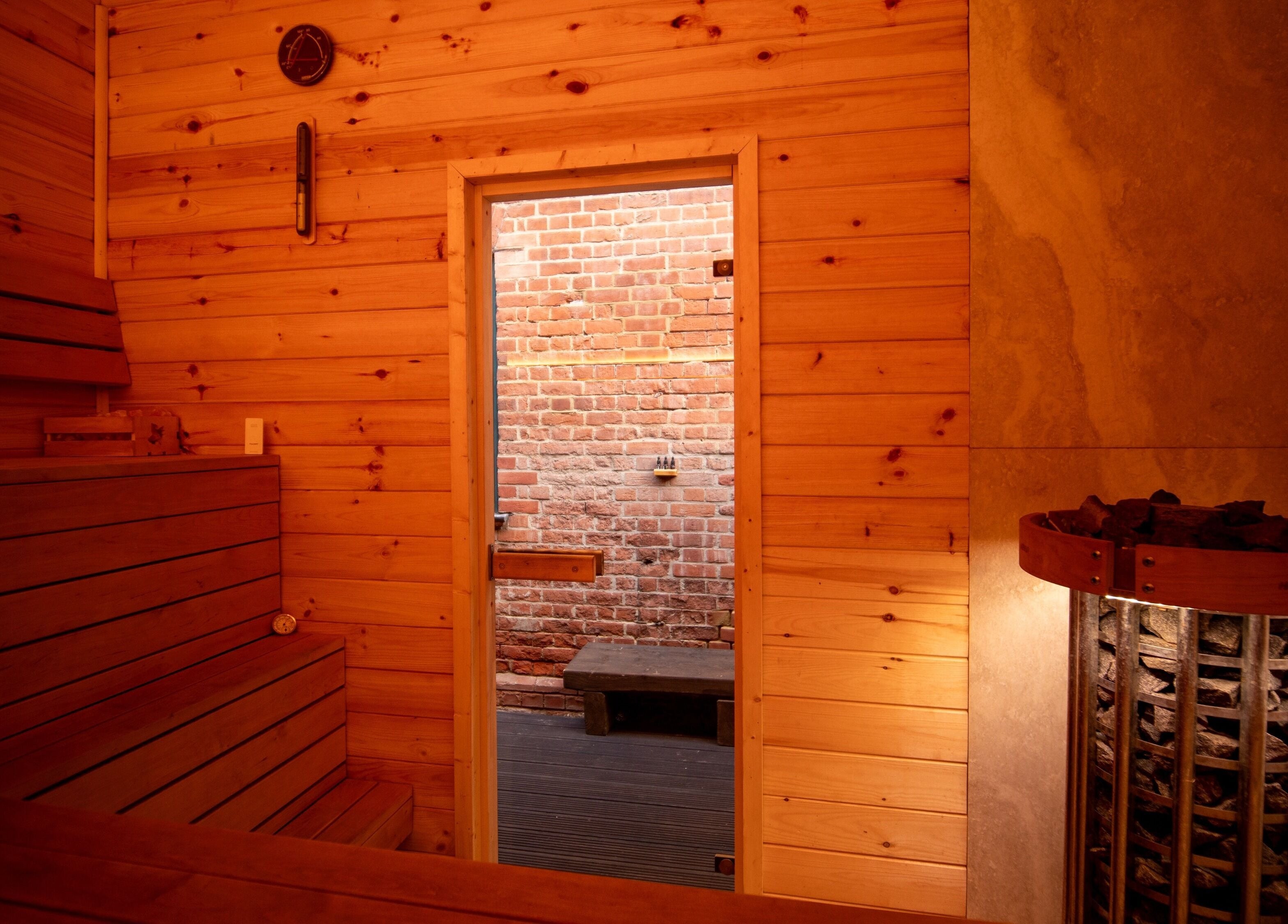Cozy wooden interior of Phoenix Burning Sauna in London, England, GB, showcasing warm sauna ambiance.