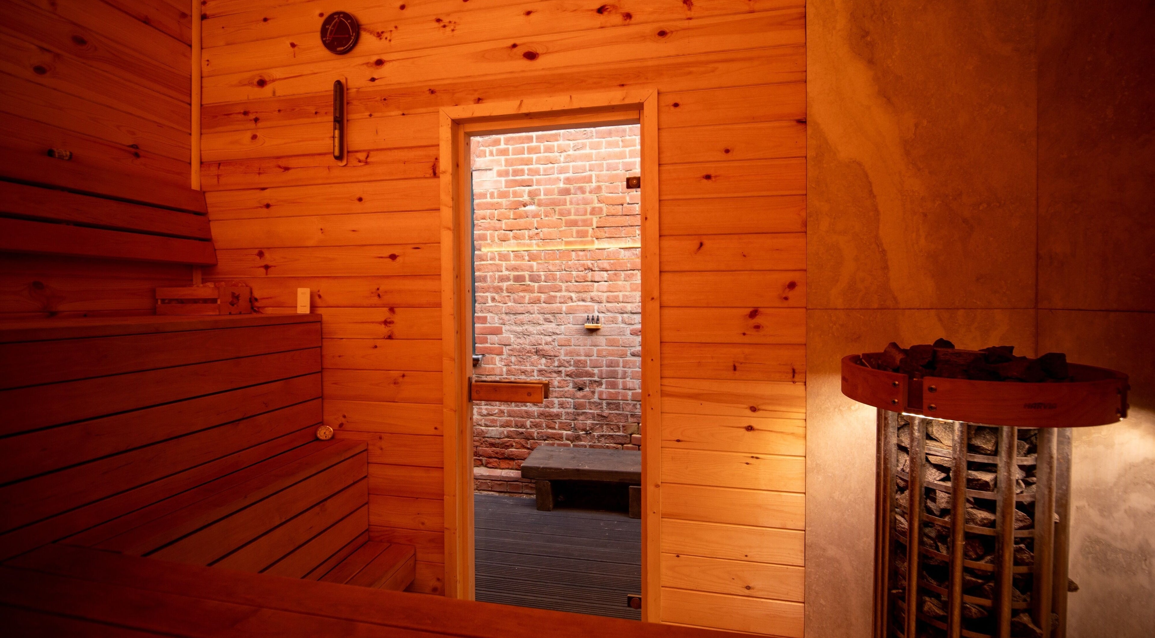 Cozy wooden interior of Phoenix Burning Sauna in London, England, GB, showcasing warm sauna ambiance.
