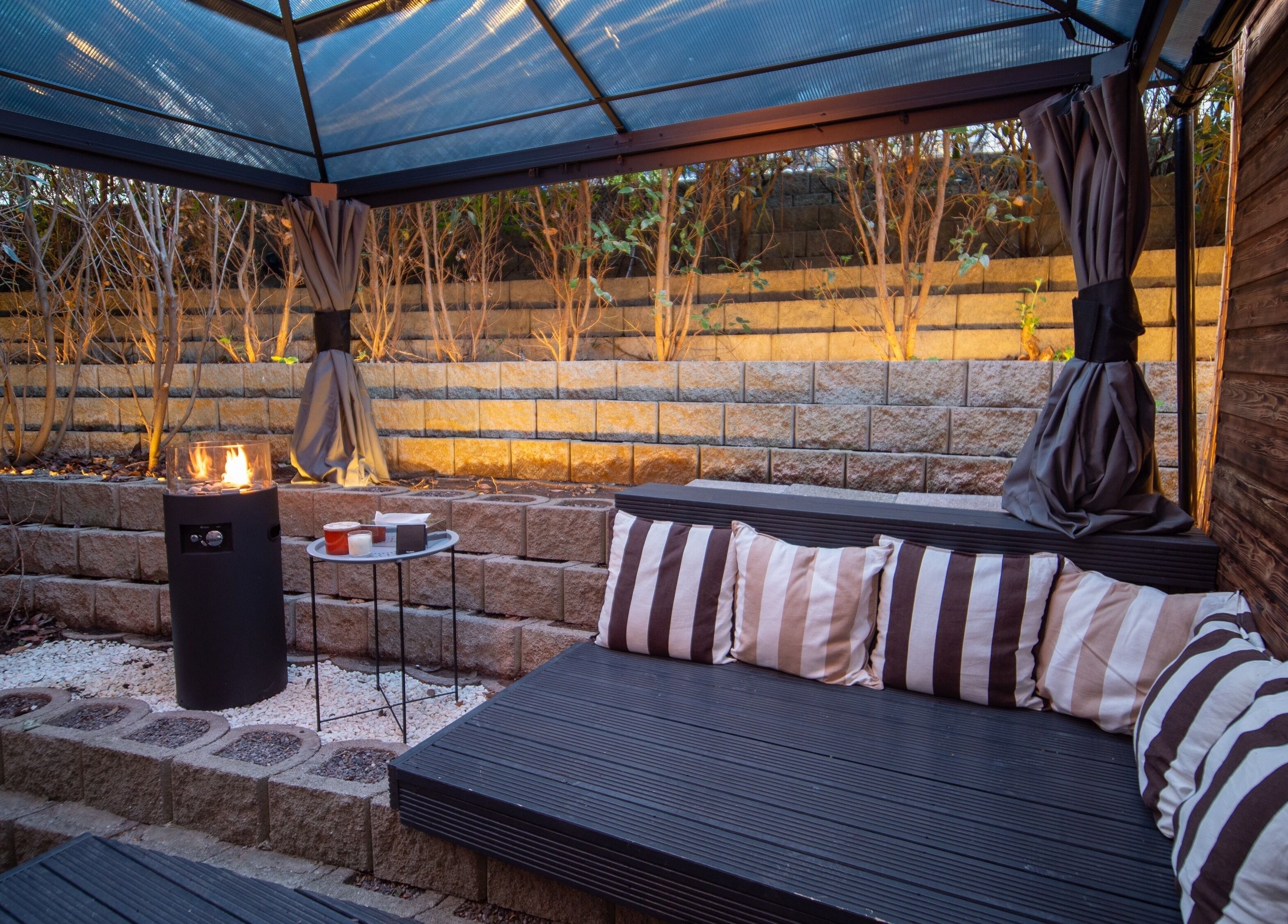 Relaxing seating area at Phoenix Burning Sauna, London, England, GB with warm lighting and stylish decor.