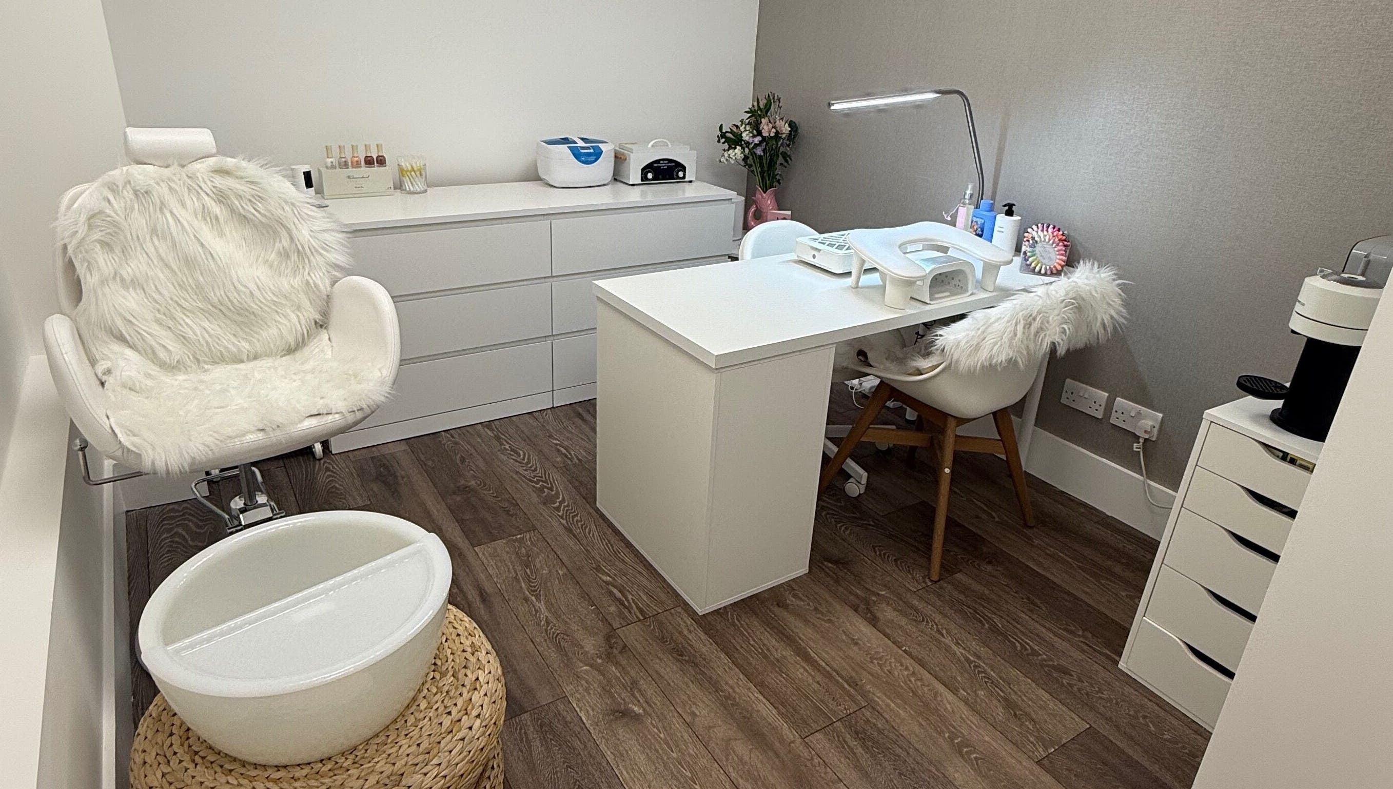 Cozy manicure station at The Manicurist by CM, London, England, GB, featuring plush seating and modern decor.