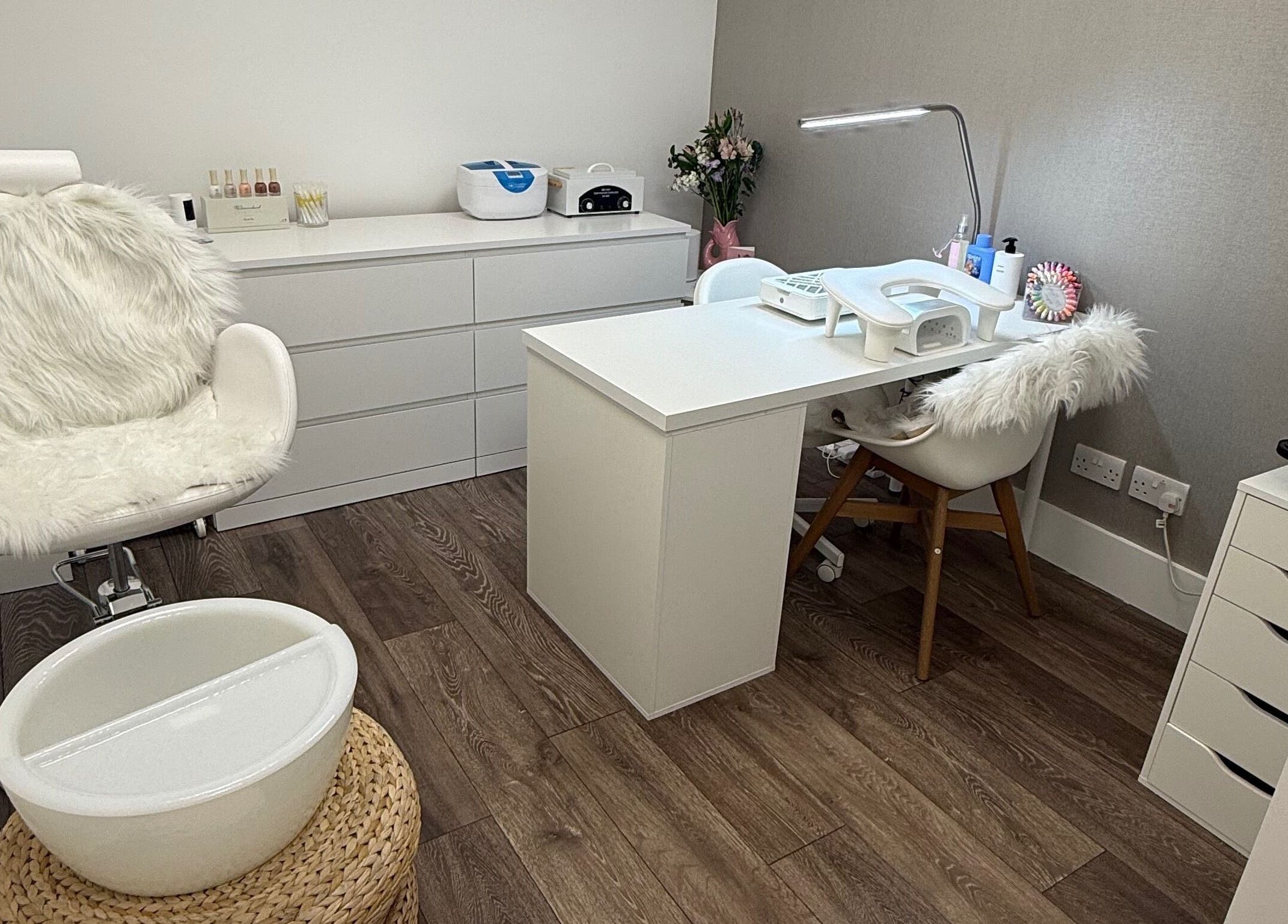 Cozy manicure station at The Manicurist by CM, London, England, GB, featuring plush seating and modern decor.