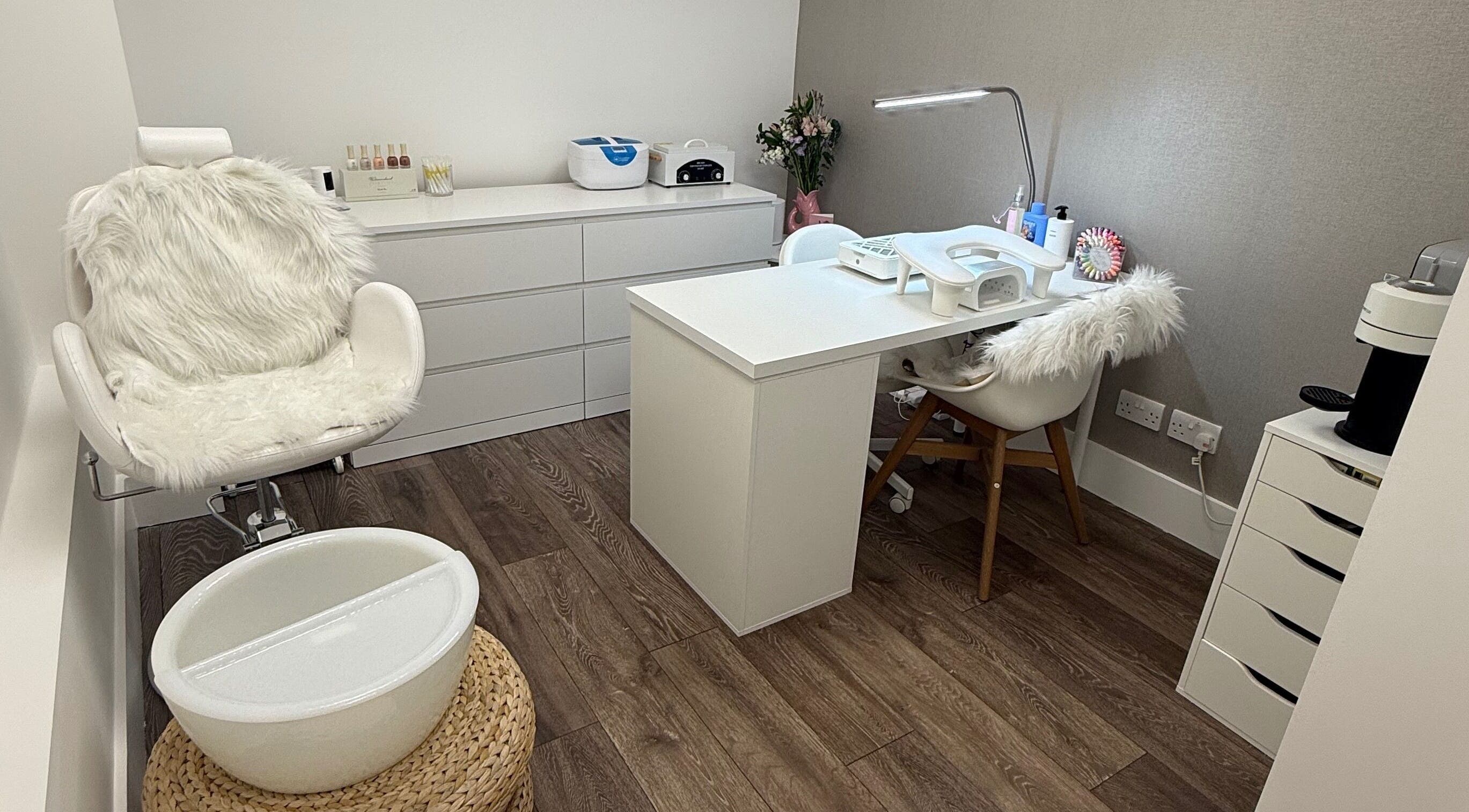 Cozy manicure station at The Manicurist by CM, London, England, GB, featuring plush seating and modern decor.