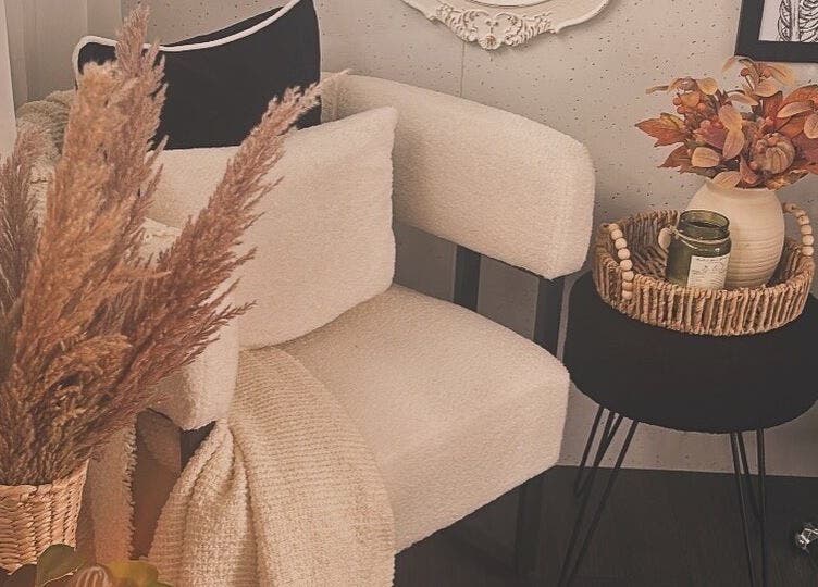 Cozy corner at ETCHED.byMeganBuchan in Leven Fife, Scotland, GB with plush chair and autumnal accents.