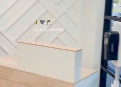 Reception area at Creative Hands Salon, Tampa, Florida, with elegant decor and modern accents.