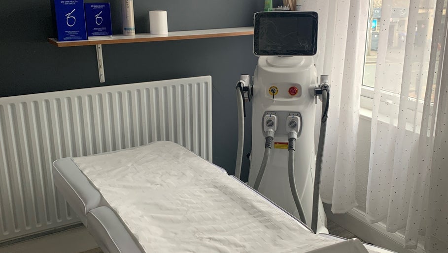 Treatment room at Skin & Laser Aesthetics, Smethwick, England, GB, featuring modern equipment and a serene setup.