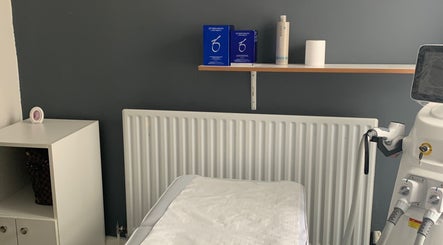 Treatment room at Skin & Laser Aesthetics, featuring equipment and a cozy setup in Smethwick, England, GB.