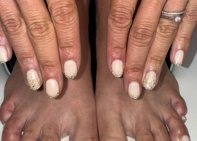 Elegant nude nails with gold glitter at Ae Beauty Studios, Edinburgh, Scotland, GB.