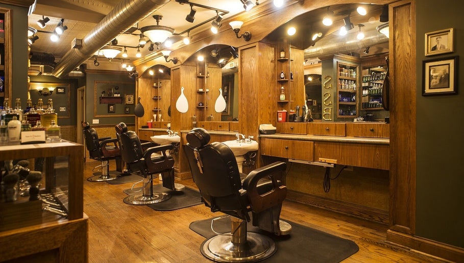Elegant barber chairs and wooden interior at Quick n Easy, Birmingham, Alabama, US.