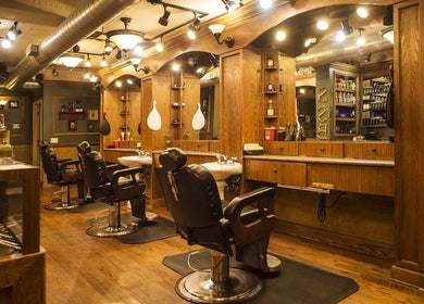 Elegant barber chairs and mirrors at Quick n Easy in Birmingham, Alabama, US, showcasing vintage salon ambiance.