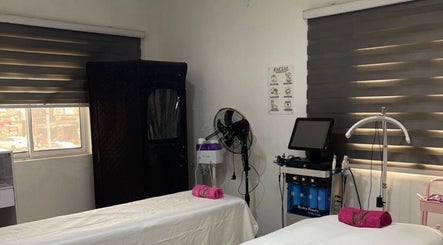 Relaxing treatment room at Vl Medspa, Abulegba, Lagos, NG with two massage beds and modern equipment.