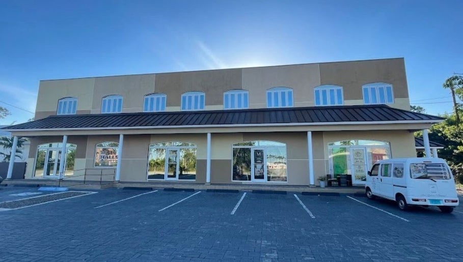 Licithestylist venue exterior in Freeport, BS with bright windows and ample parking space.