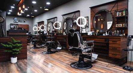 Chic interior of Ali N Barbershop in Den Haag, Zuid-holland, NL, featuring modern barber chairs and lighting.