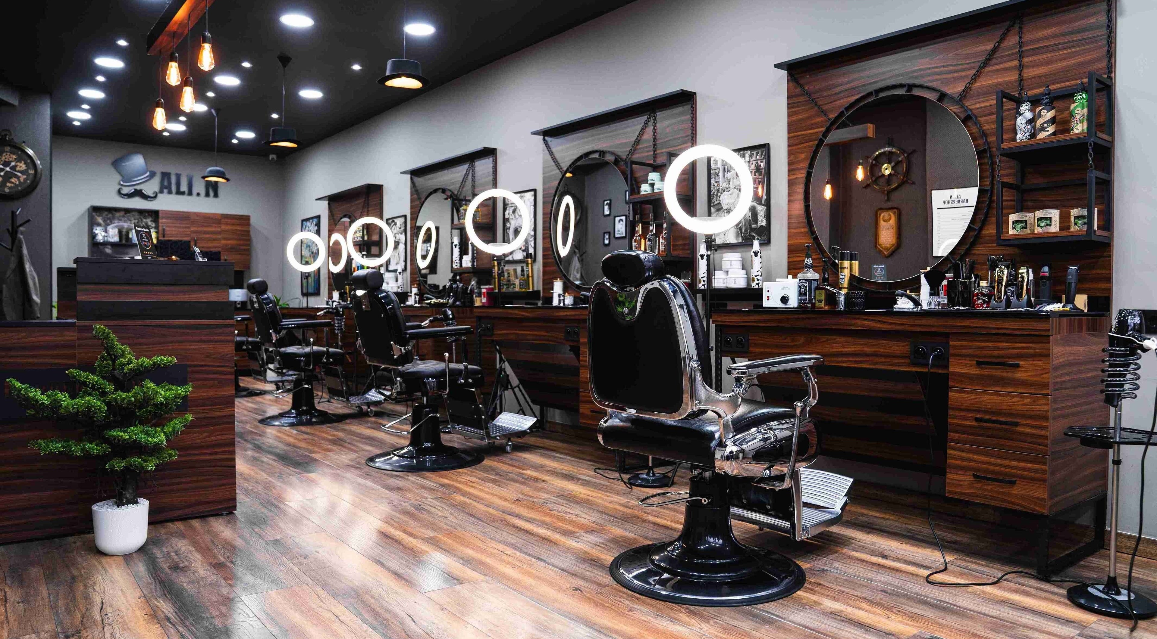 Chic interior of Ali N Barbershop in Den Haag, Zuid-holland, NL, featuring modern barber chairs and lighting.