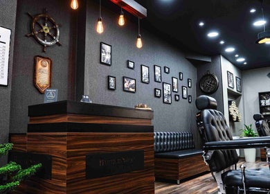 Chic interior of Ali N Barbershop at Den Haag, Zuid-holland, NL with modern decor and barber chairs.