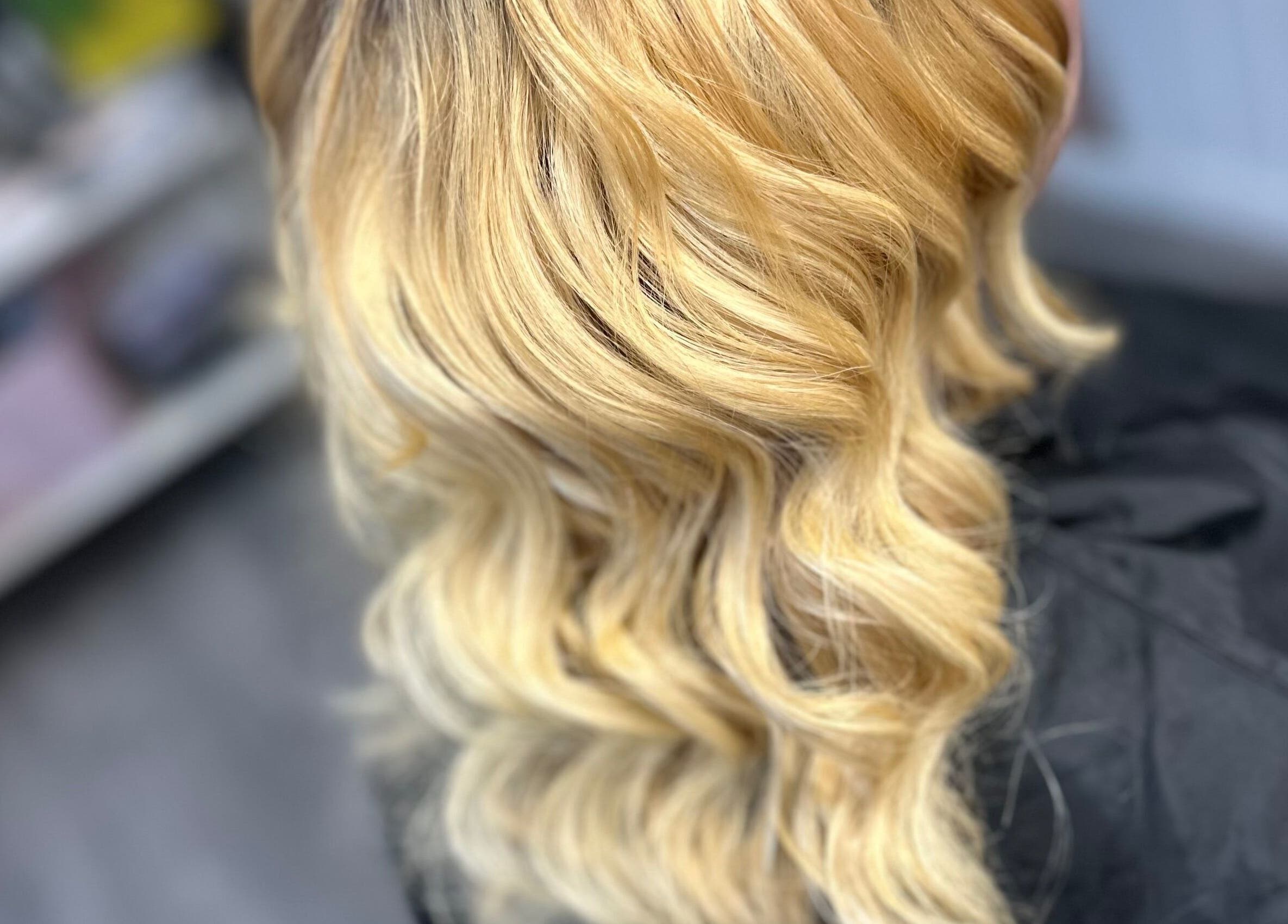 Golden wavy hairstyle done at All Nations Braiding Hair, Beauty and Aesthetics in Ramsey, Lezayre, IM.