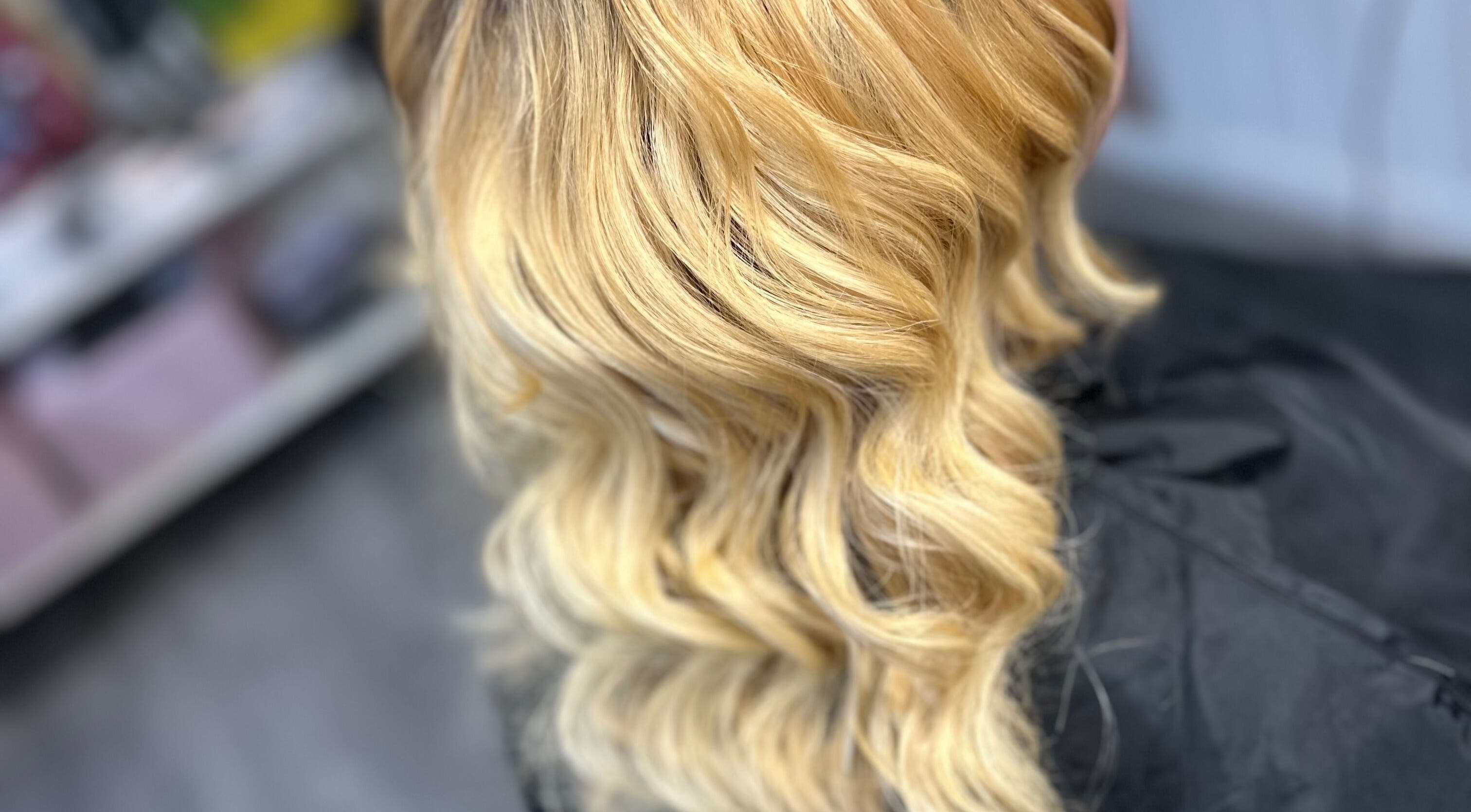 Golden wavy hairstyle done at All Nations Braiding Hair, Beauty and Aesthetics in Ramsey, Lezayre, IM.