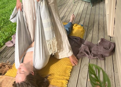 Relaxing outdoor stretch at Mumtra Doula, Gordonton, Waikato Region, NZ on a sunny deck.