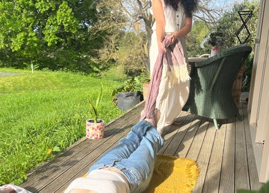A relaxing session at Mumtra Doula, Gordonton, Waikato Region, NZ on a sunny porch with lush greenery.