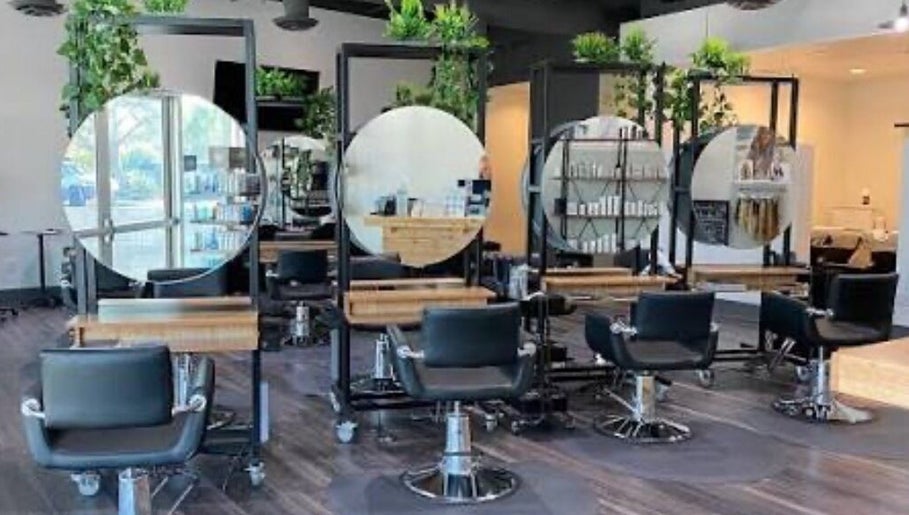 Modern salon chairs and mirrors at Hairdonebyv in Los Angeles, California, US.