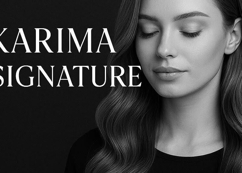 Karima Signature.ca à Montréal, Québec, CA. Portrait élégant d'une femme sereine aux cheveux ondulés.