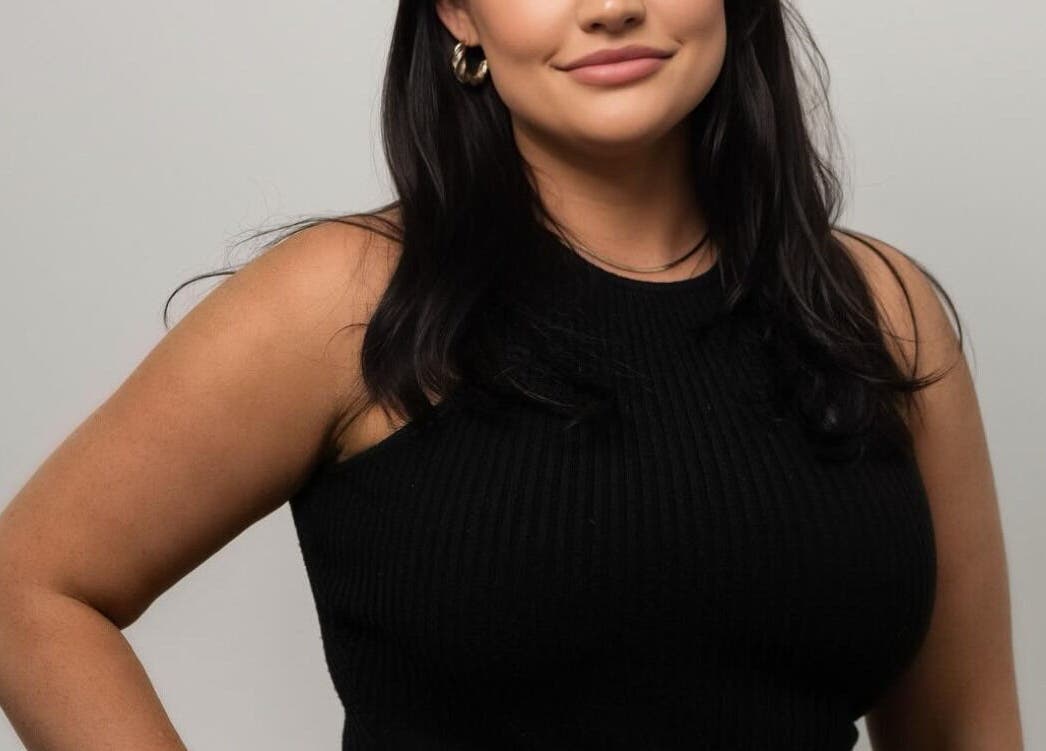 Relaxed woman in a black dress at The Skin Room Brisbane, Bongaree, Queensland, AU.