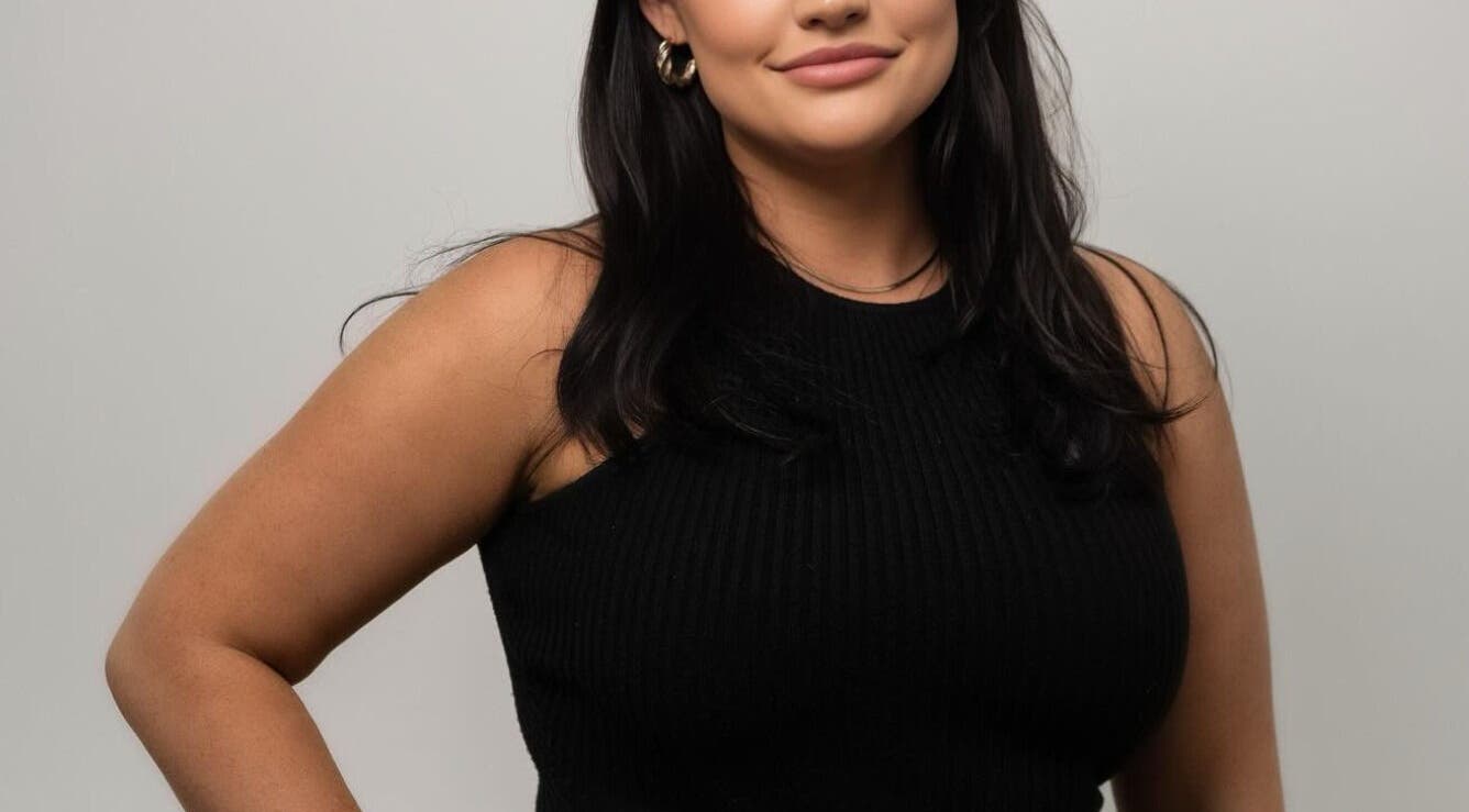 Relaxed woman in a black dress at The Skin Room Brisbane, Bongaree, Queensland, AU.