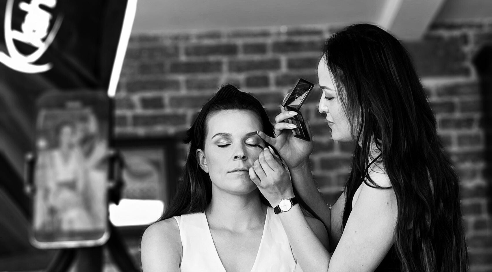 Makeup artist enhancing eyes at Melissa’s Artistry Collective, North West, North West, ZA.