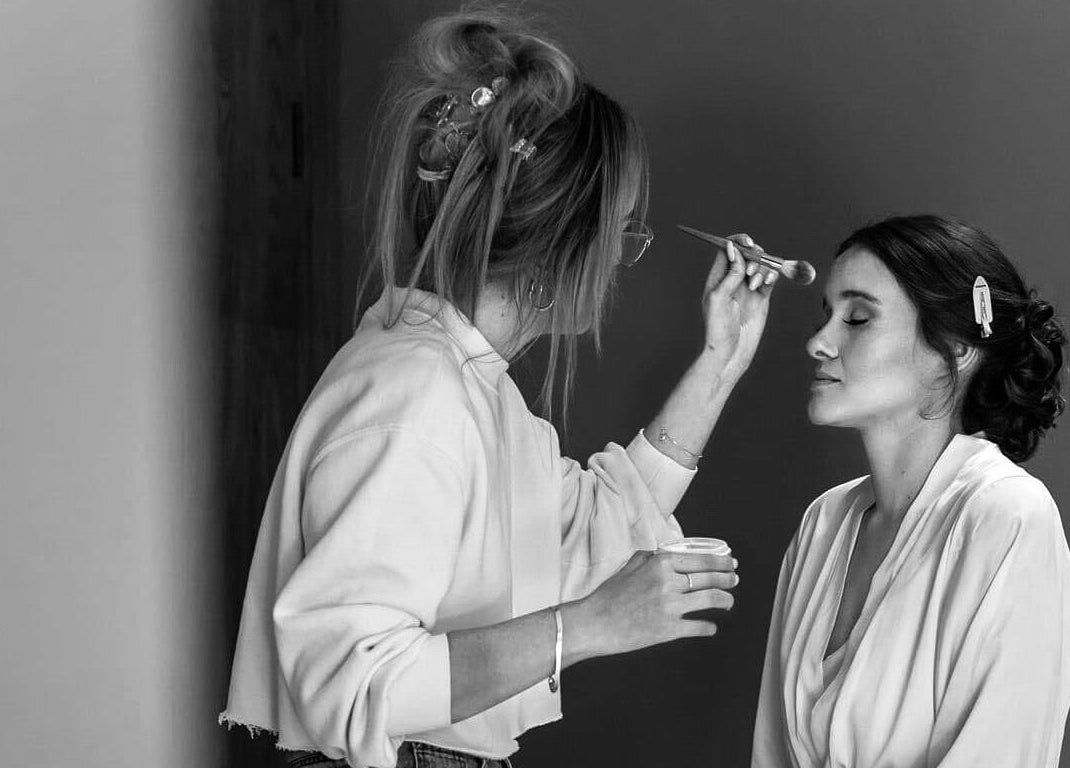 Makeup artist at Melissa’s Artistry Collective, North West, North West, ZA, applying cosmetics.