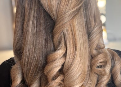 Elegant curled hairstyle at The Blowout Boutique, Leeds, England, GB.