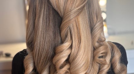 Elegant curled hairstyle at The Blowout Boutique, Leeds, England, GB.