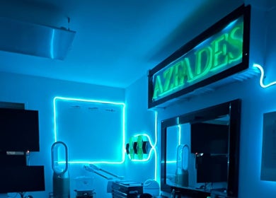 AZFADES-PRIVATE STUDIO in London, England, GB illuminated with blue neon lights for a modern wellness ambiance.