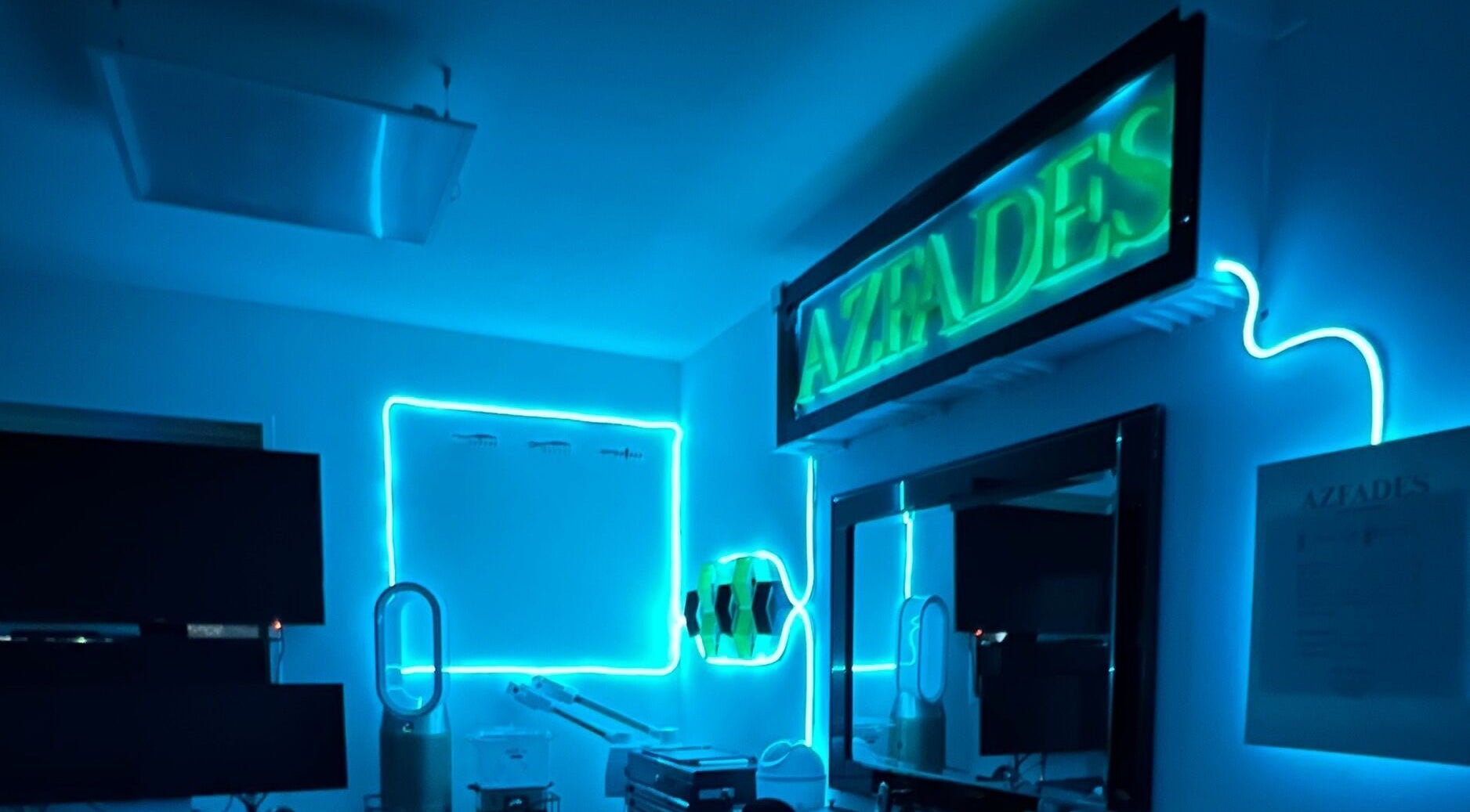 AZFADES-PRIVATE STUDIO in London, England, GB illuminated with blue neon lights for a modern wellness ambiance.