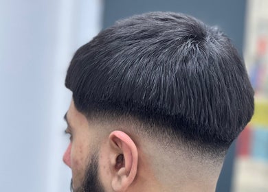 Sharp haircut at AZFADES- PRIVATE STUDIO in London, England, GB showcasing expert barber skills.
