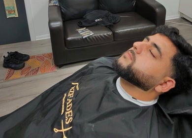 Man relaxing in barber chair at AZFADES- PRIVATE STUDIO, London, England, GB. Plush setting.