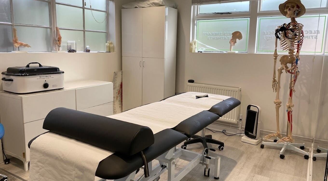 Therapy room at Active Remedy with massage table and anatomy model in Norwich, England, GB.