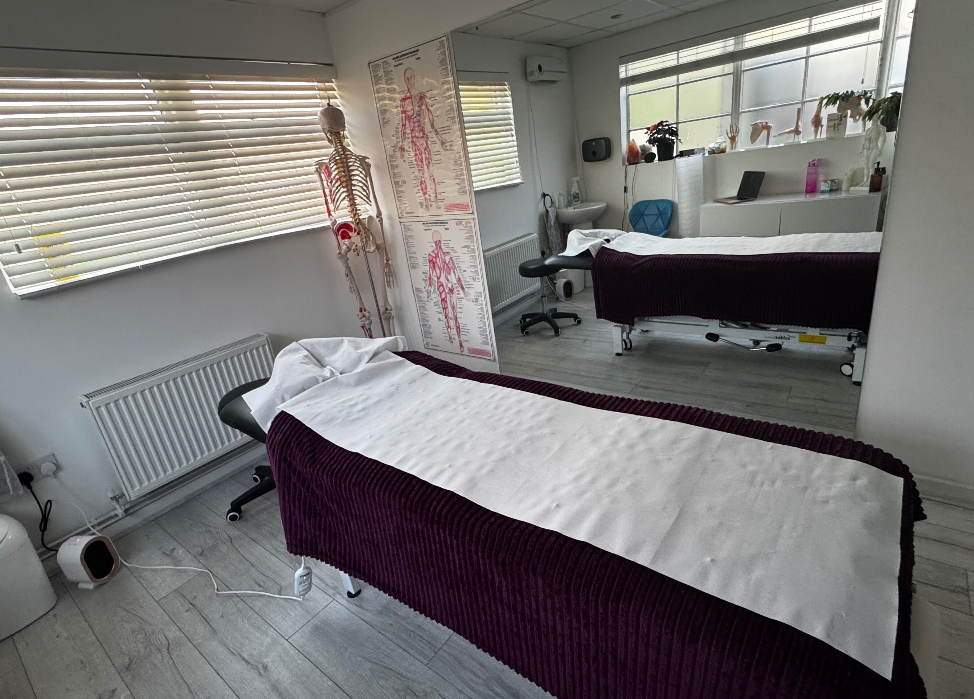 Therapy room at Active Remedy with two massage tables, Norwich, England, GB, creating a calming atmosphere.