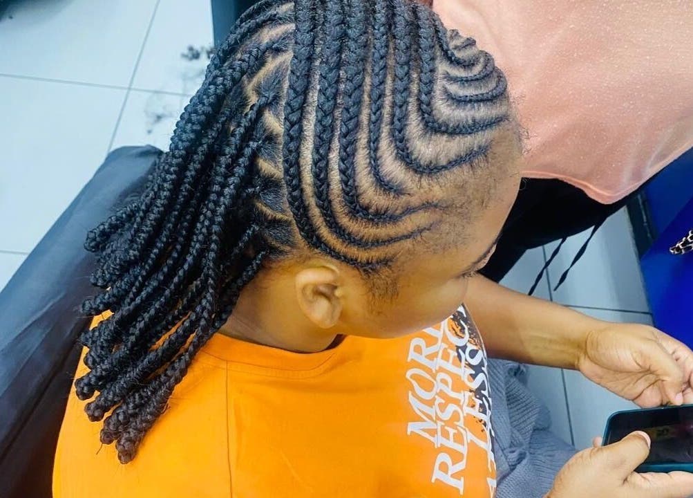 Intricate braided hairstyle at Serenity Beauty Parlour in Cape Town, Western Cape, ZA.