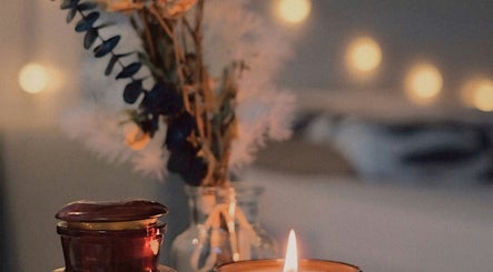 Warm candlelit ambiance at The Skin Sanctuary, Aylmer, Ontario, CA. Cozy wellness retreat atmosphere.