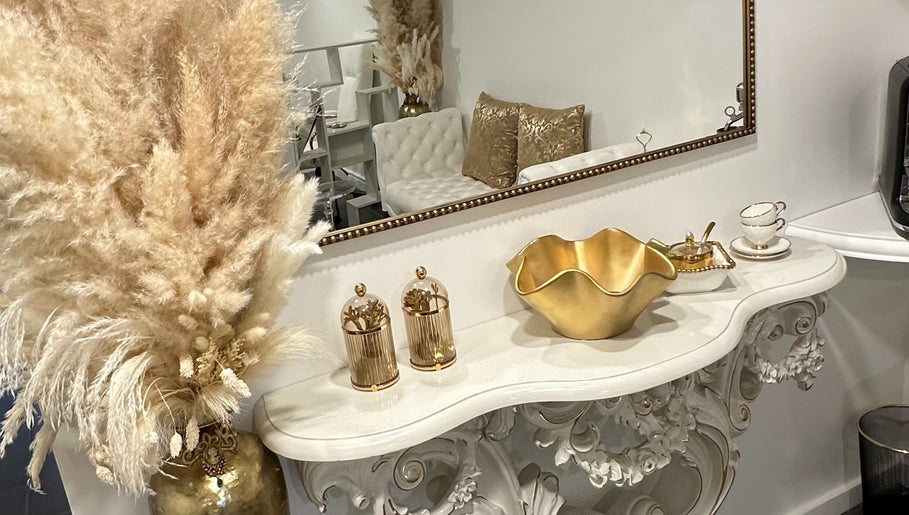 Luxurious decor at Spa Maluge, Hoboken, New Jersey, US with gold accents and elegant furnishings.