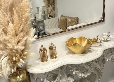 Luxurious decor at Spa Maluge, Hoboken, New Jersey, US with gold accents and elegant furnishings.