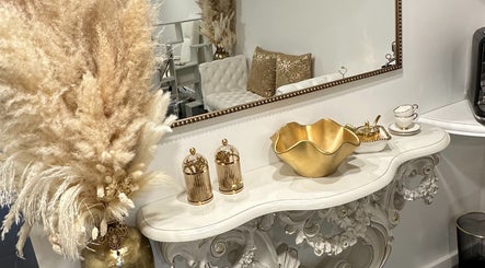 Luxurious decor at Spa Maluge, Hoboken, New Jersey, US with gold accents and elegant furnishings.