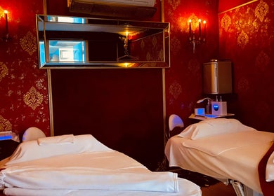 Elegant treatment room at Spa Maluge, Hoboken, New Jersey, US with two plush massage tables.