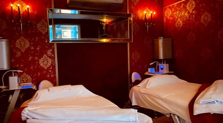 Elegant treatment room at Spa Maluge, Hoboken, New Jersey, US with two plush massage tables.