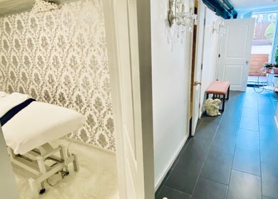 Luxurious spa hallway at Spa Maluge in Hoboken, New Jersey, US, showcasing an inviting massage room entrance.